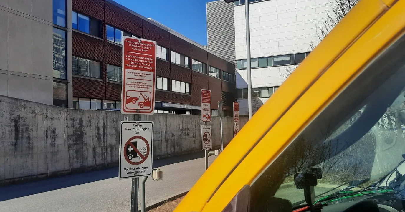BPT24-7 stretcher van parked in the Ambulance and Patient Transport Vehicle bay at the Ottawa Hospital for a hospital discharge transfer