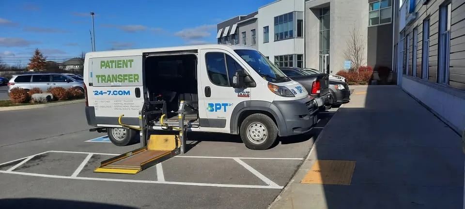 BPT24-7 wheelchair-accessible van with side-lift ramp lowered for BRODA reclining wheelchair loading