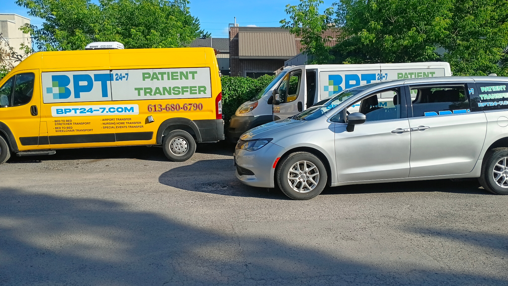 BPT24-7 patient transfer fleet — stretcher van, wheelchair-accessible van and Pacifica at the Ottawa base