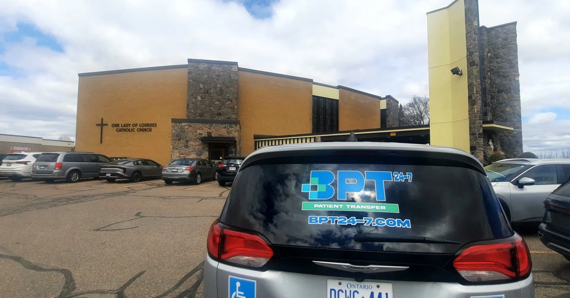 BPT24-7 branded Chrysler Pacifica patient transfer vehicle on location in the Ottawa region